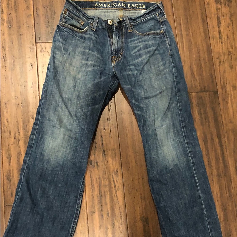 Men’s light washed blue denim boot cut jeans